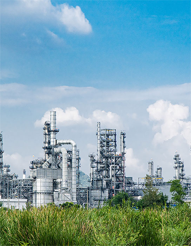Refinery with a cloudy, blue sky